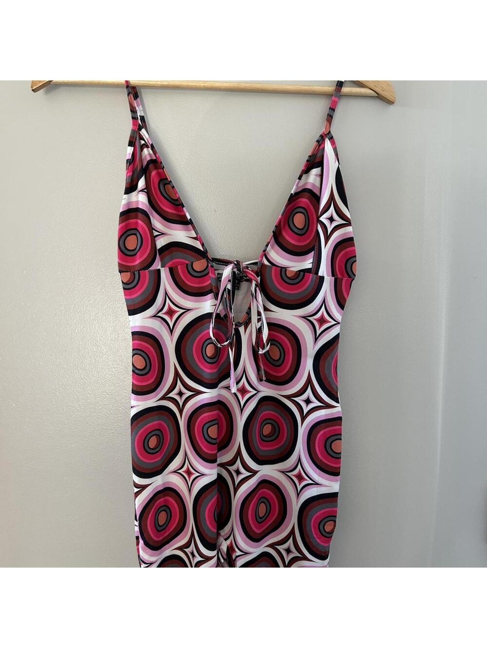 Lovehoney pink and black jumpsuit with tie up detail